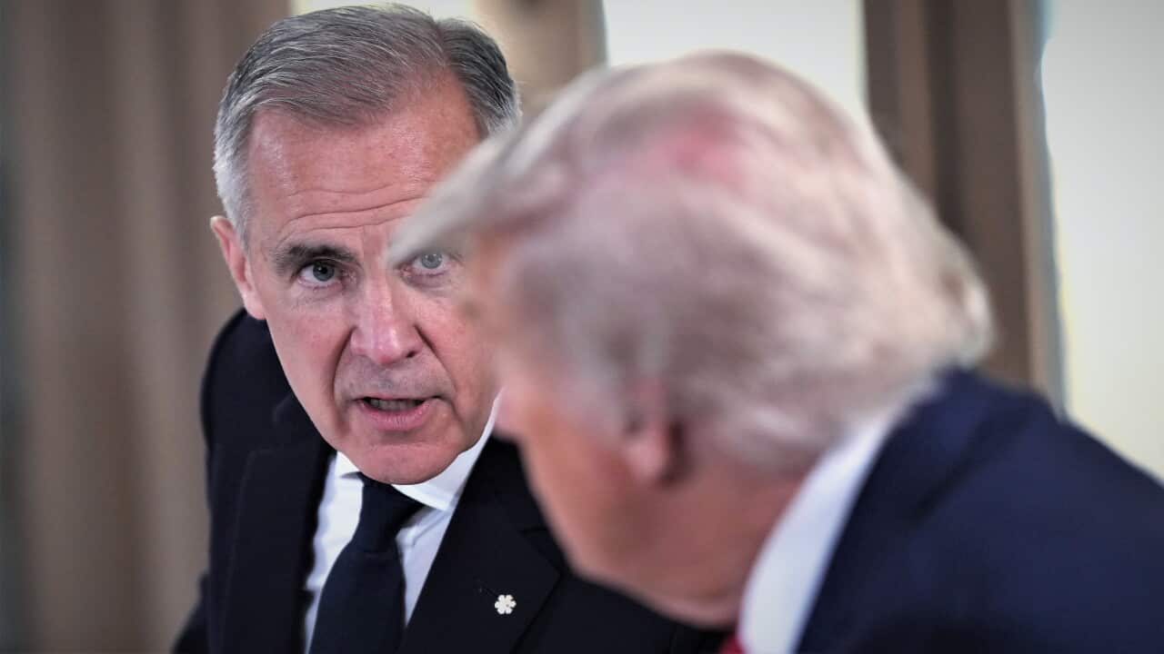 Canada Prime Minister Mark Carney stares at US President Donald Trump in close up