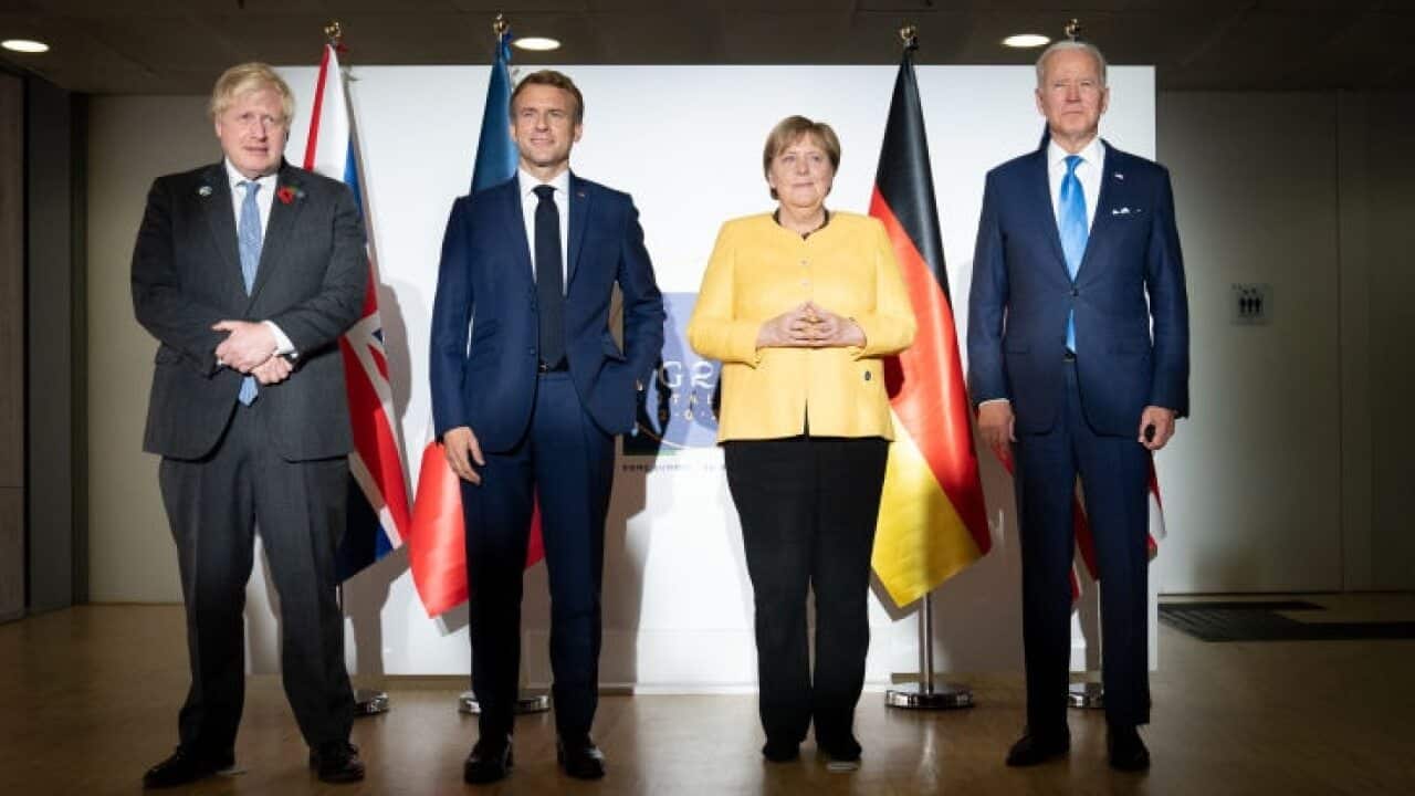 British Prime Minister Boris Johnson, French President Emmanuel Macron, German Chancellor Angela Merkel, and US President Joe Biden at the G20.