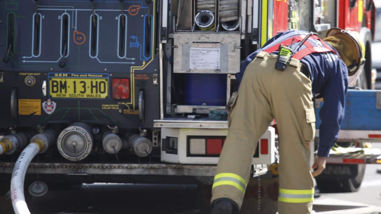 Fire and police emergency services at a scene of a fire