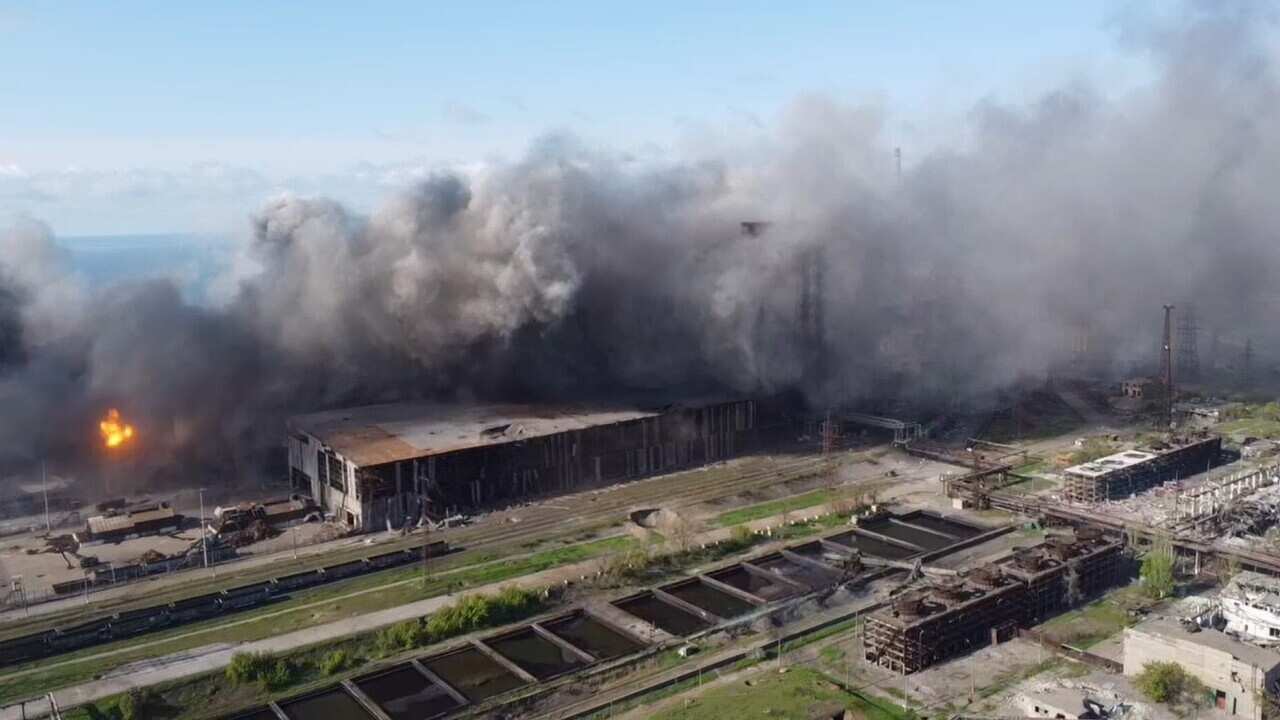 Smoke rising from an industrial plant.