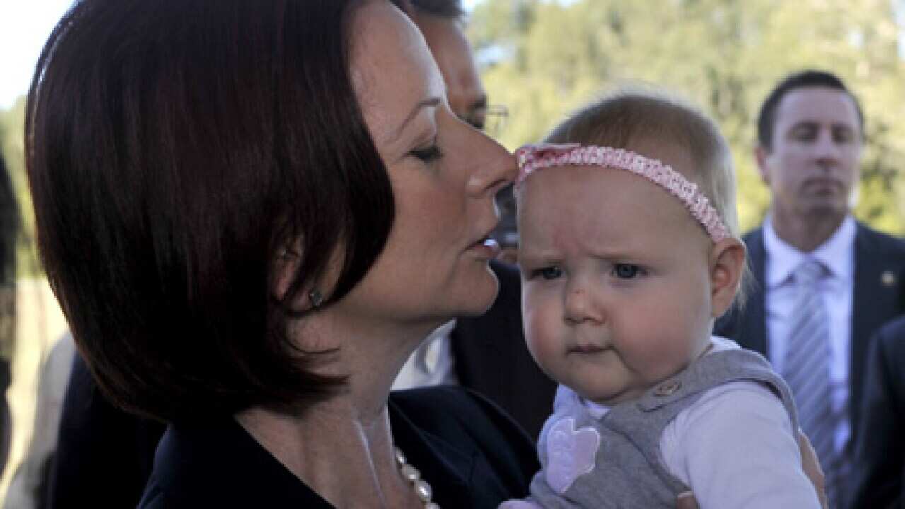gillard_holding_baby_100803_B_AAP_1406140276