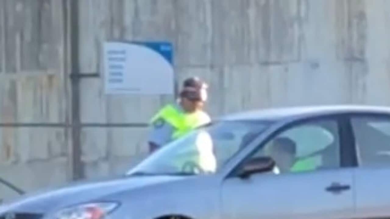 The officer was filmed on a mobile phone telling a driver to 'go back to China'.