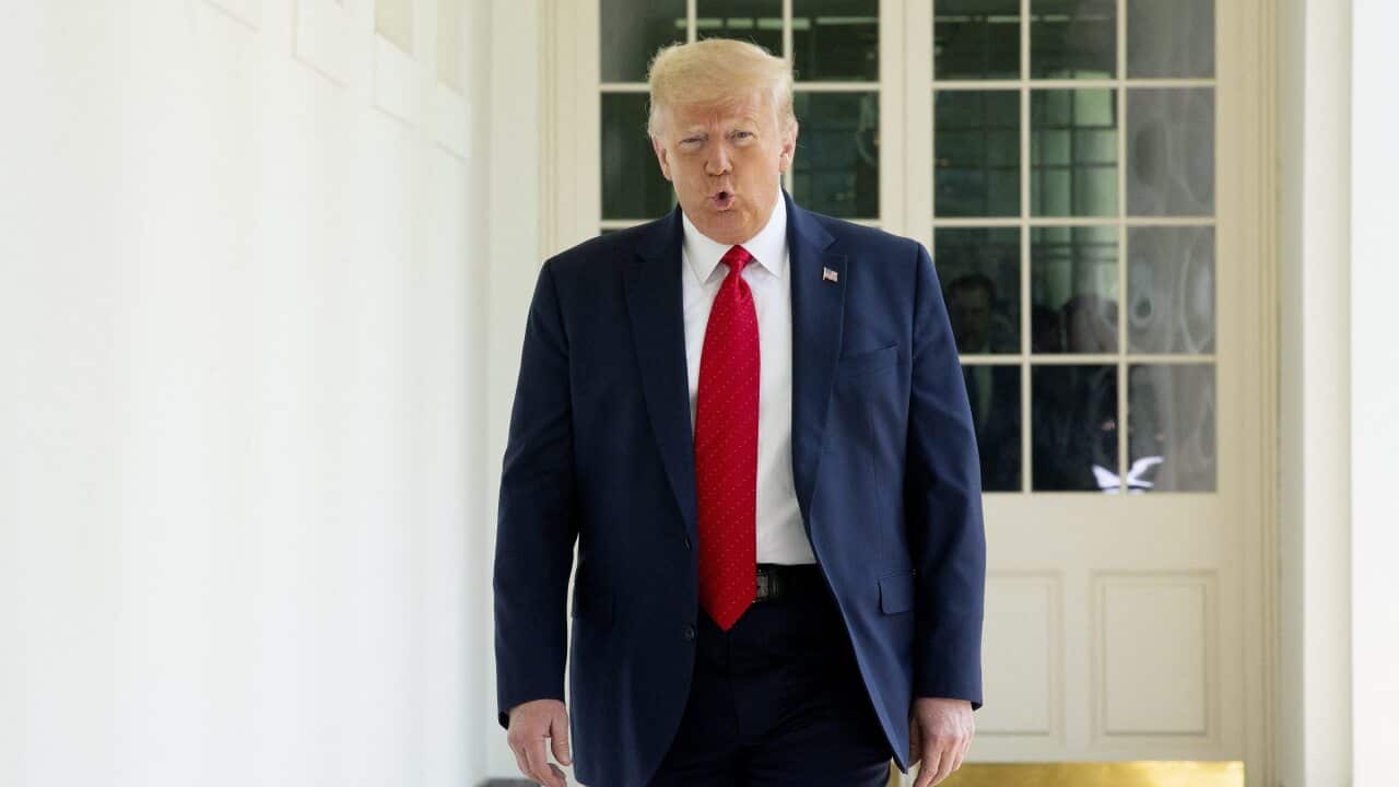US President Donald Trump arrives to the Rose Garden to sign an Executive Order on Safe Policing for Safe Communities at the White House.