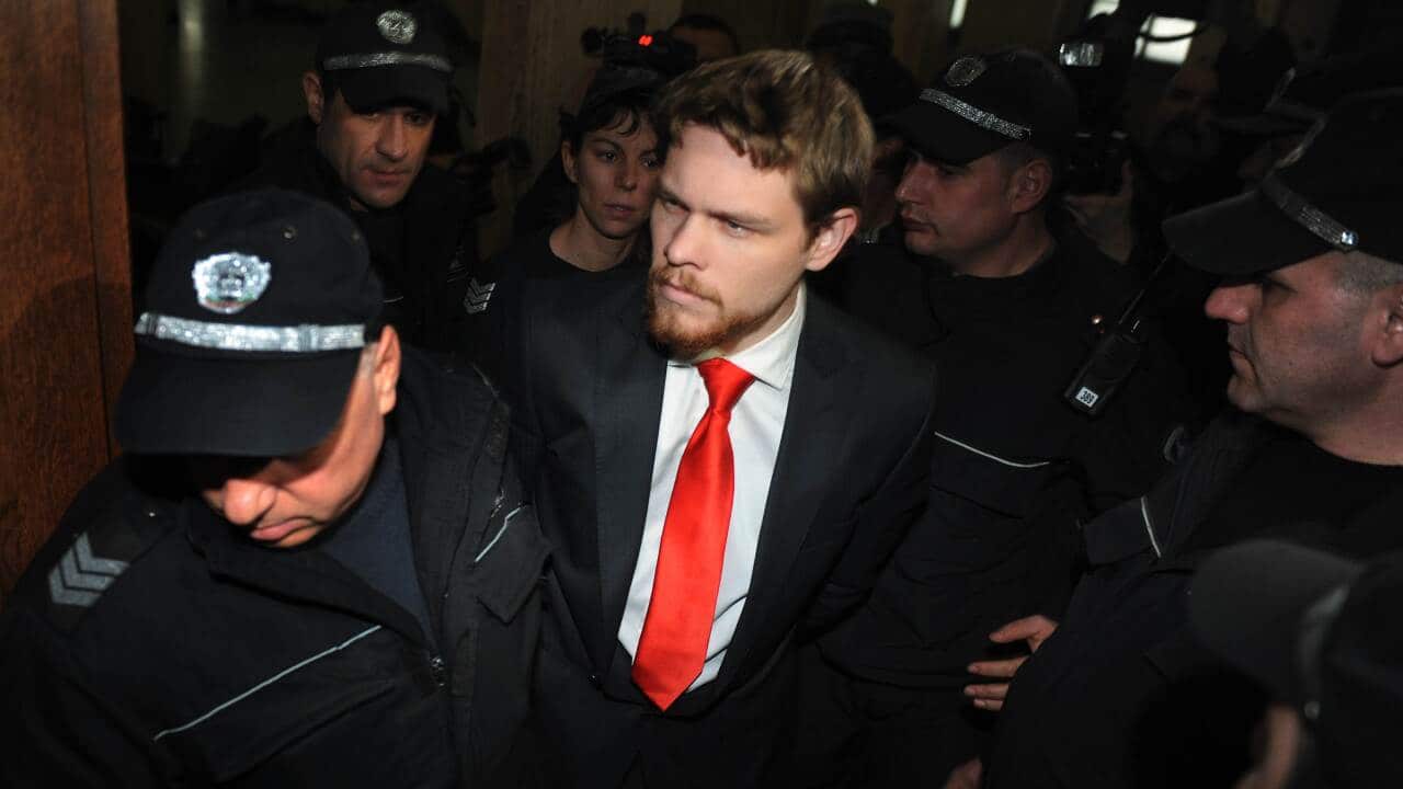 Bulgarian police officers escort AustralBulgarian police officers escort Australian Jock Palfreeman.