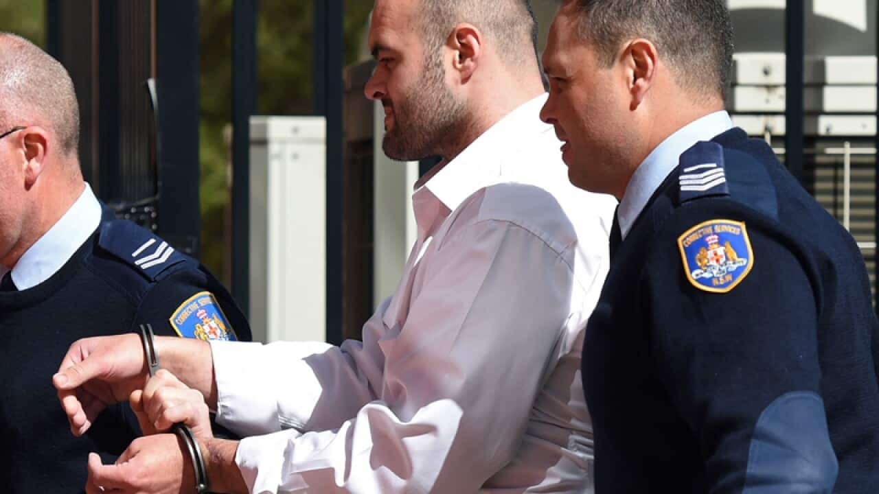 Vincent Stanford is escorted into Griffith Local Court