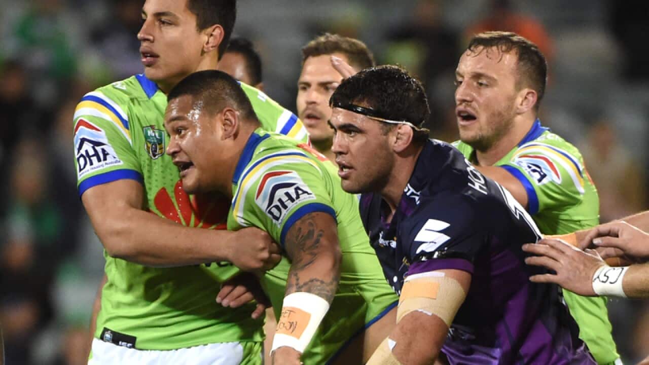 Joseph Leilua of the Raiders (C) reacts after a suspect tackle
