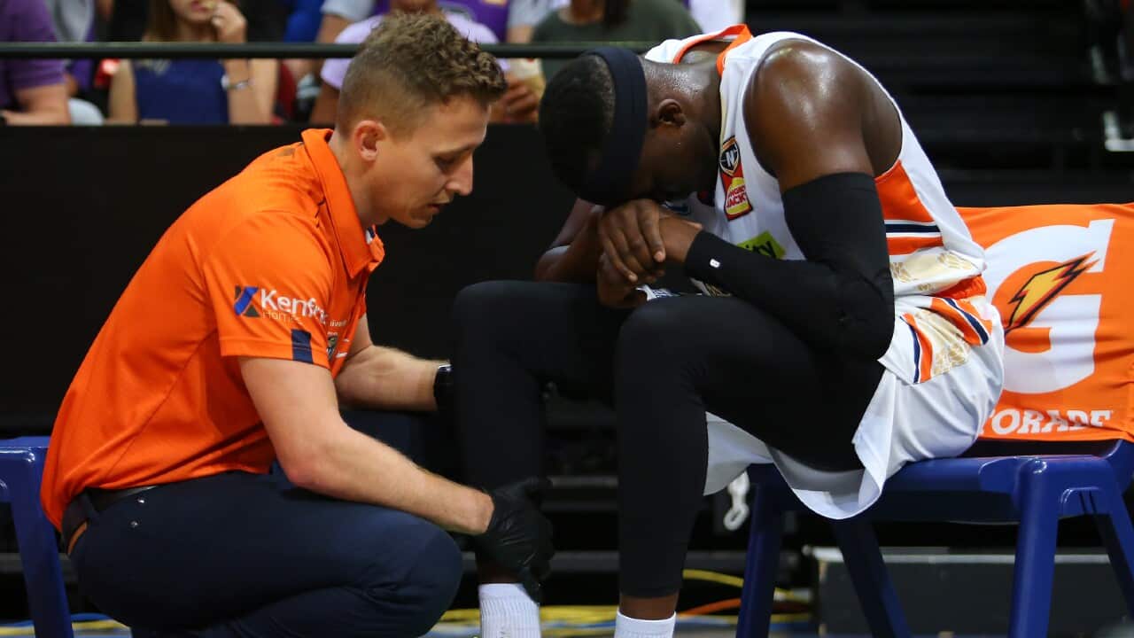 Kouat Noi reacts after sustaining an injury