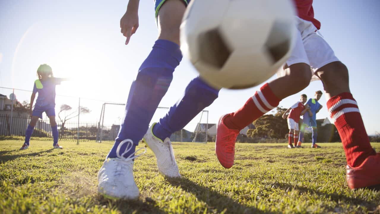 Boys playing in a soccer match