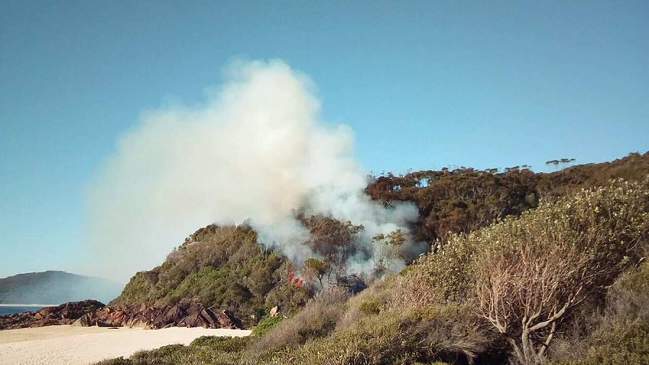 Residents have been evacuated from the area as the Salt Ash fire burned through 1300 hectares.
