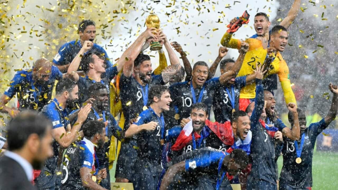 France's Olivier Giroud lifts the trophy after France won 4-2 during the final match between France and Croatia - AAP.
