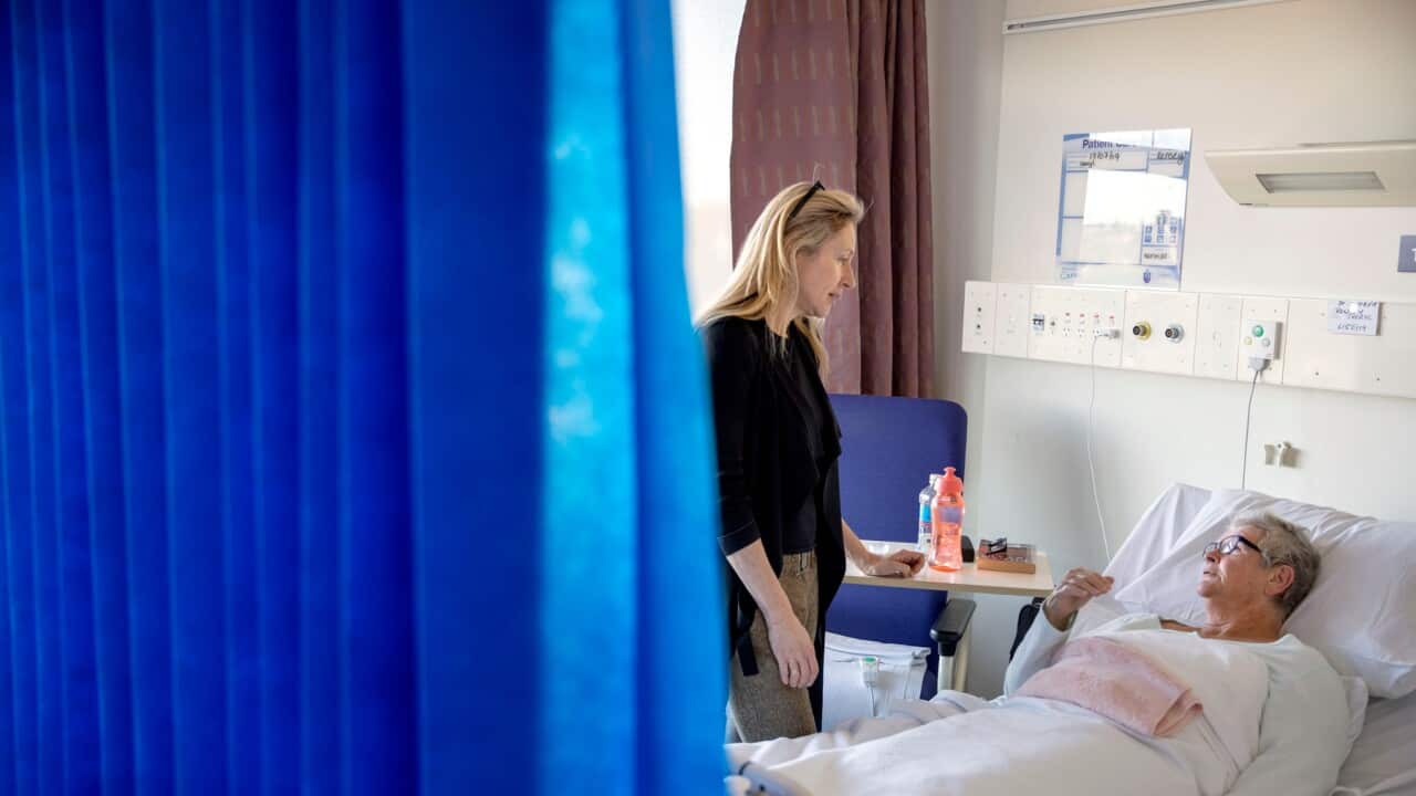 A specialist and a patient waiting for surgery at a Sydney hospital