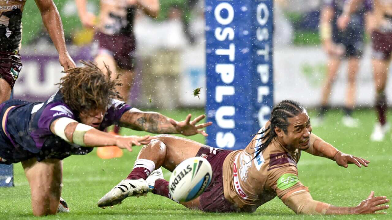 Kevin Proctor of the Storm and Steve Matai of the Sea Eagles