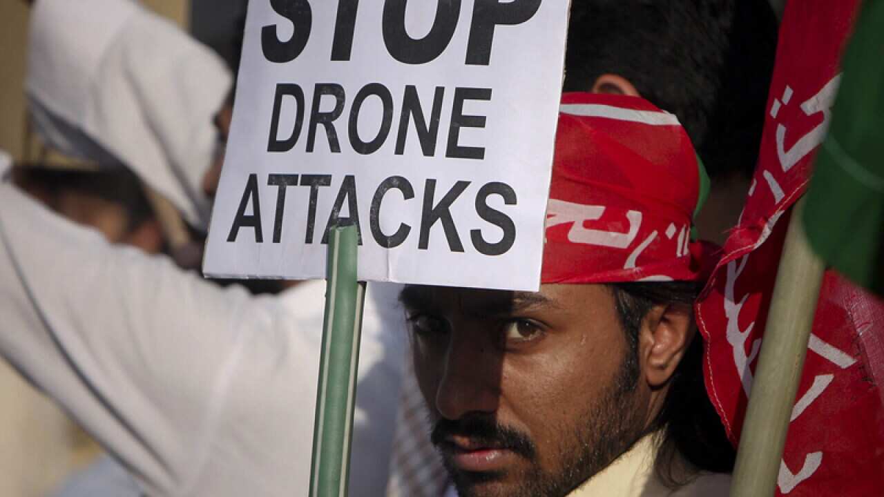 A man takes part in a rally against the U.S. drone strikes.