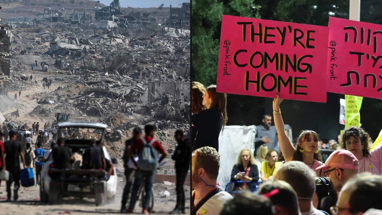 Women display placards during a gathering at Hostages Square in Tel Aviv