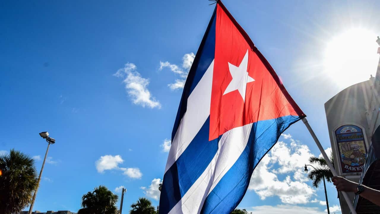 A Cuban flag flies in little Havana on 8th Street, during a demonstration in favour of Cuban freedom in La Pequea Habana.