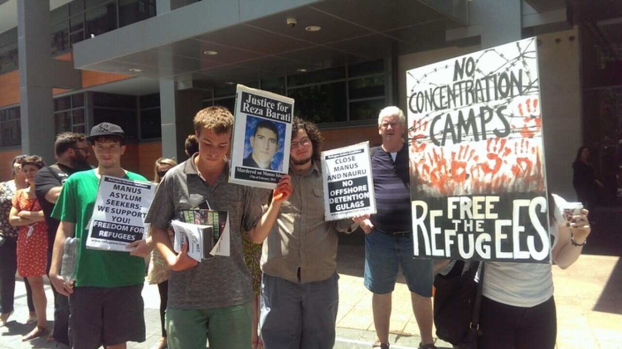 Activists in Sydney gather outside the Department of Immigration and Citizenship.
