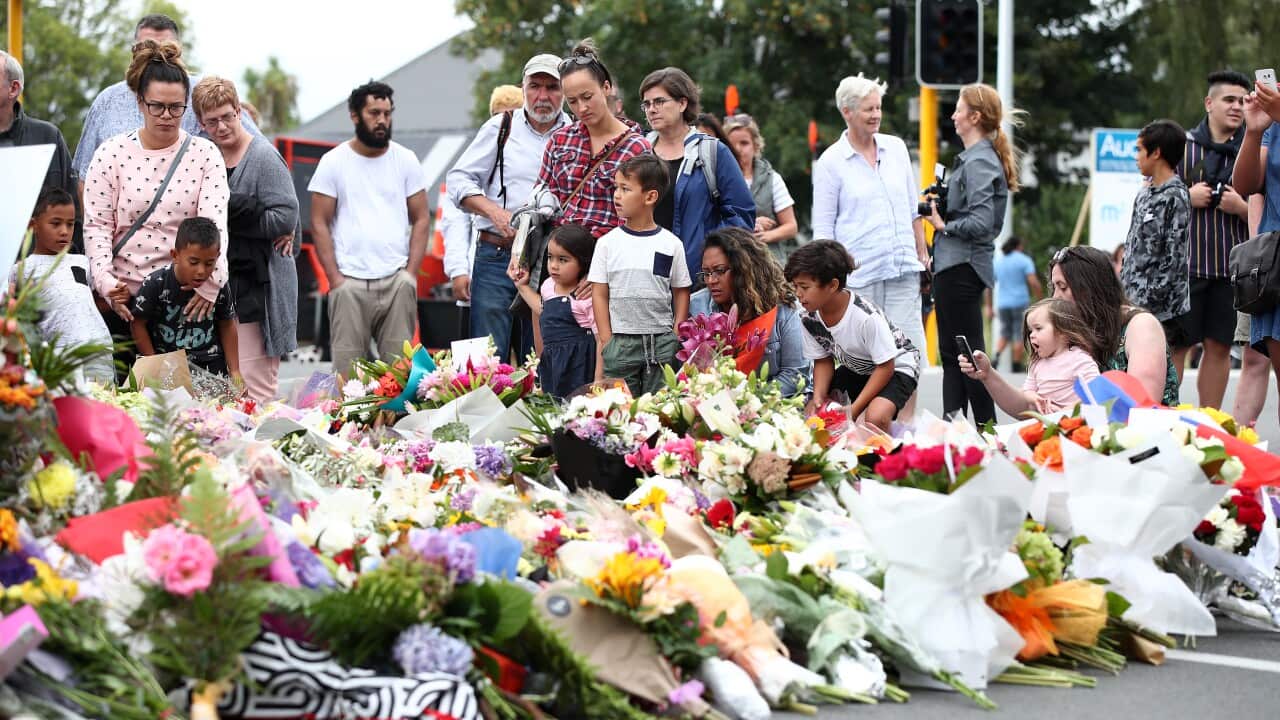 Mourners pay their respects at a makeshift memorial near the Masjid Al Noor mosque in Christchurch, New Zealand.