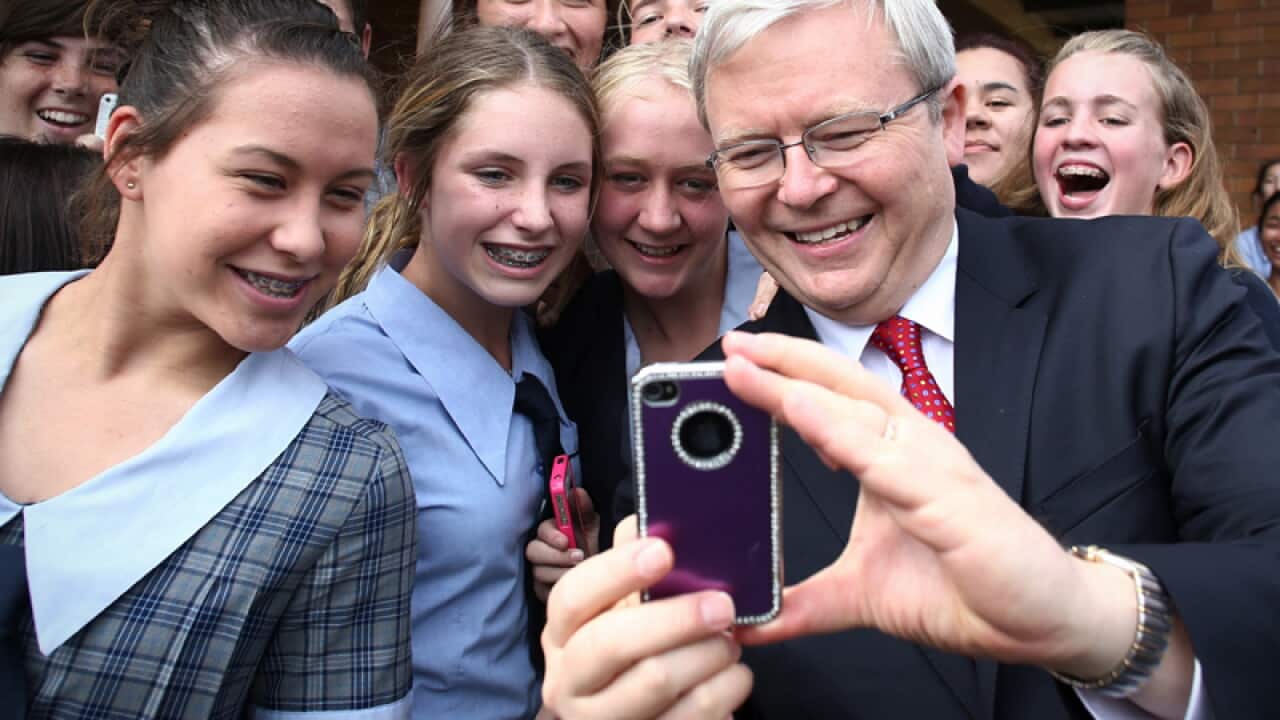 Prime Minister Kevin Rudd poses for a selfie with students