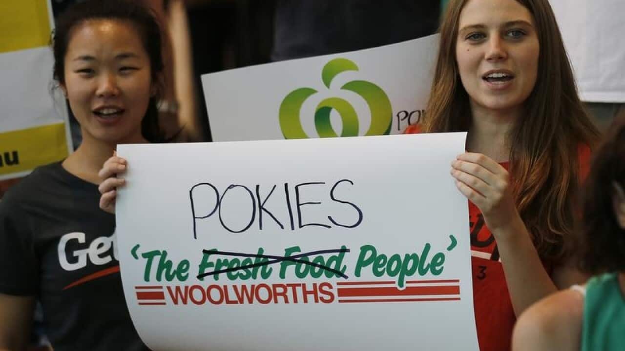 Protestors from Get Up holds signs and banners.