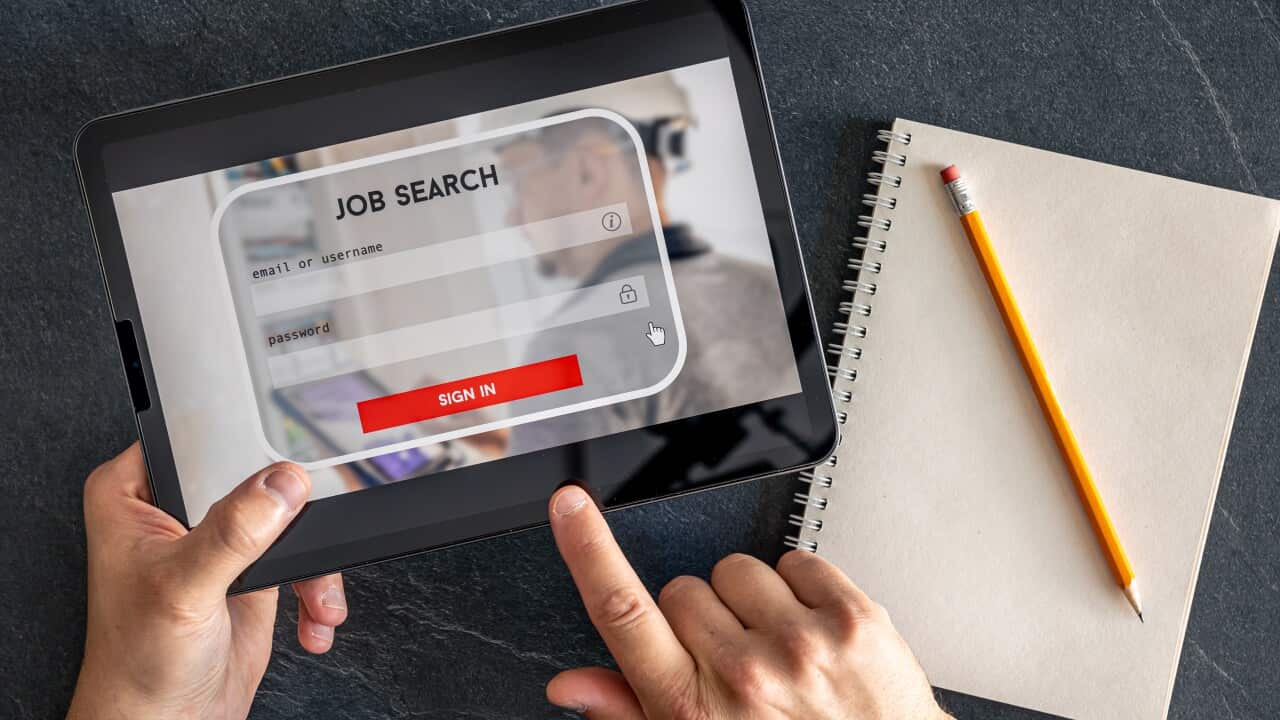 Top view of digital tablet with search job on screen in male hands.