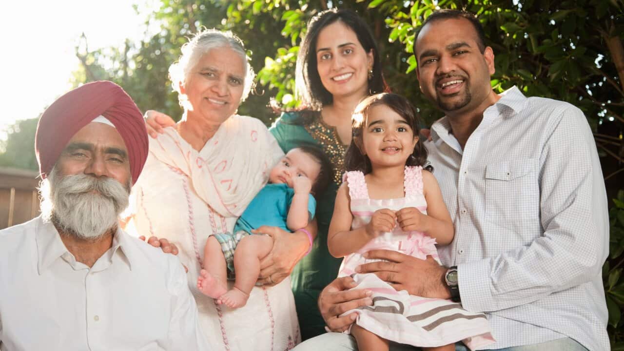 Smiling multi-generation Asian family
