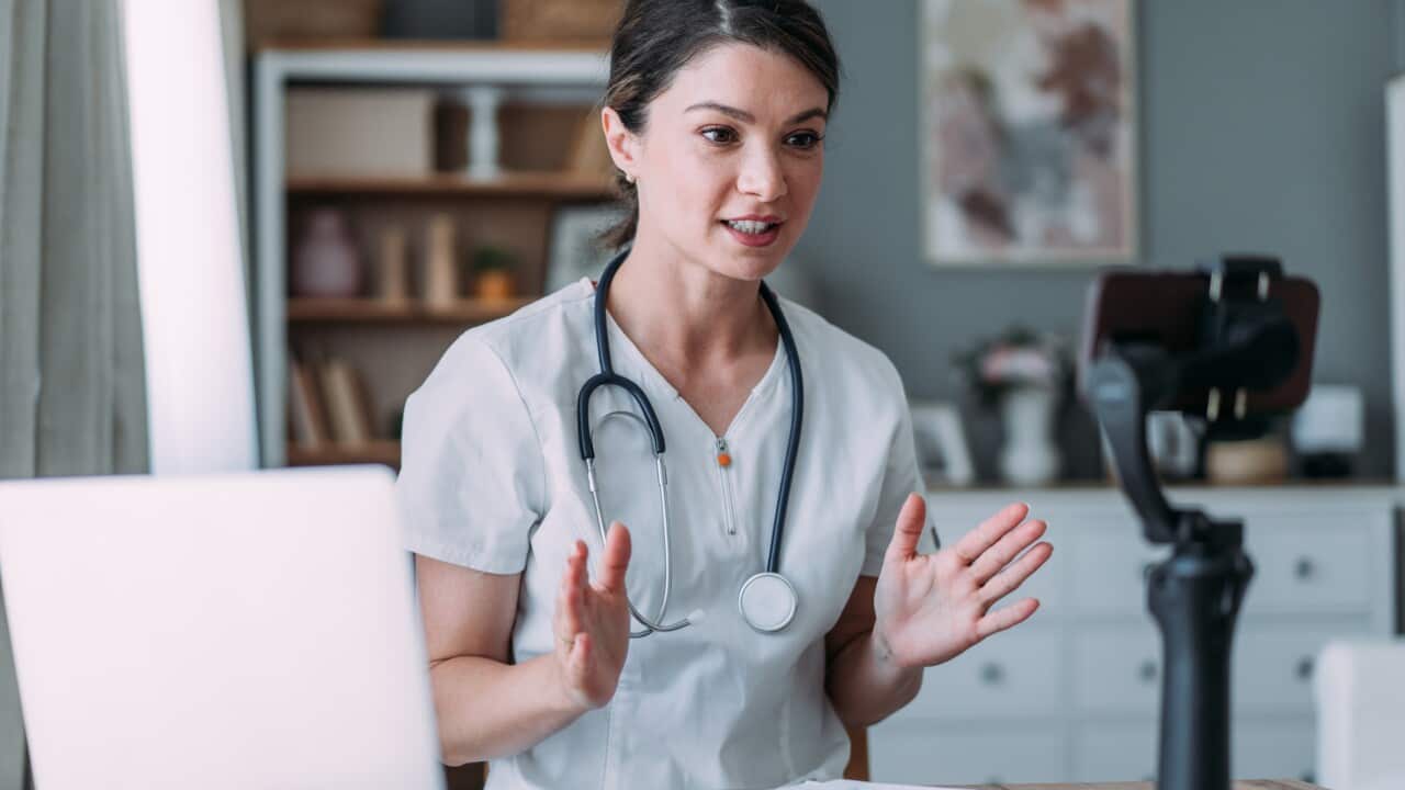 Doctor making online live streaming broadcast.