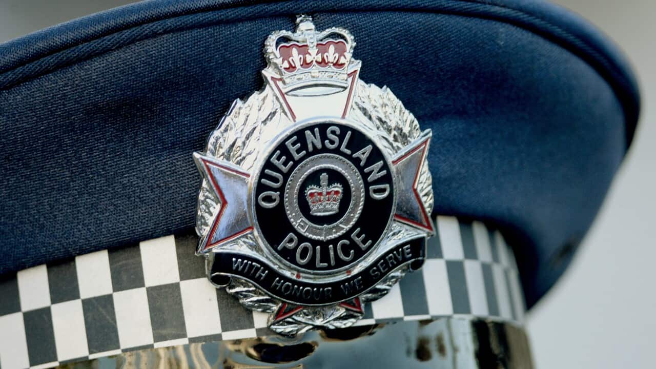 A cap with Queensland police badge