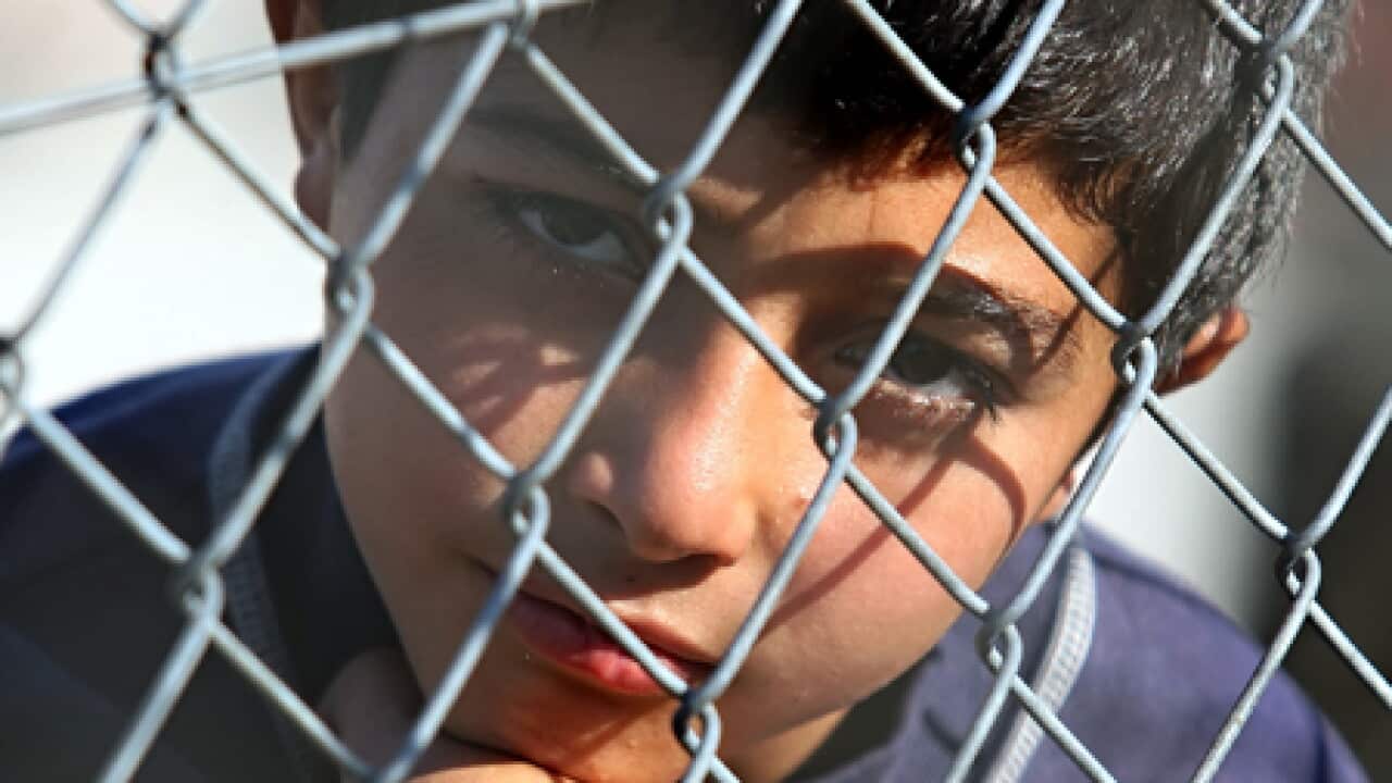 greece_fence_child_refugee_110104_B_getty_975673337