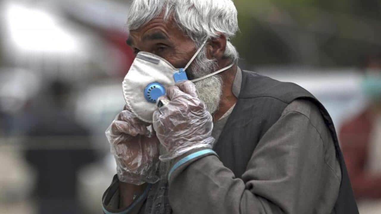 An old man in Afghanistan is protecting himself from COVID-19