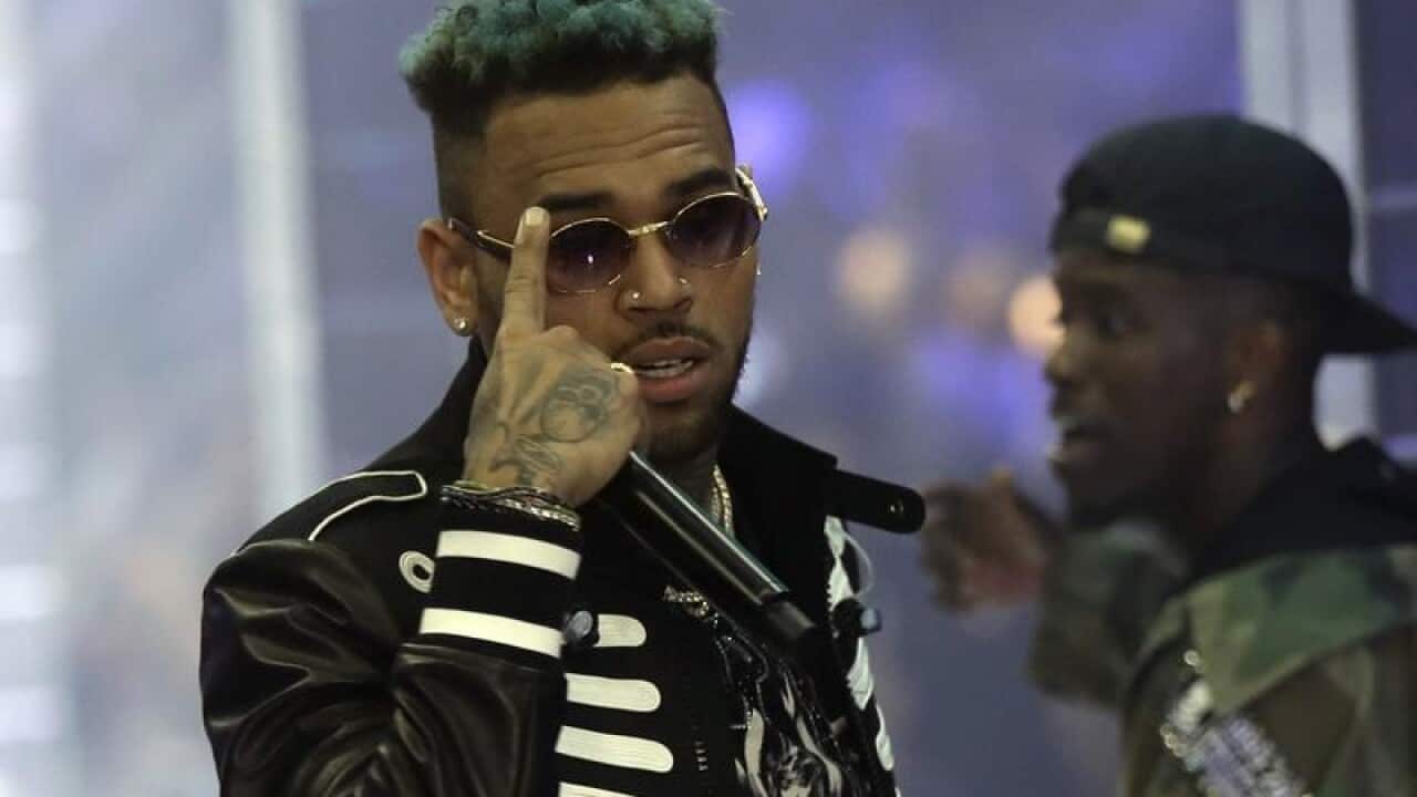 Singer Chris Brown has been arrested in France after a woman filed a rape complaint.