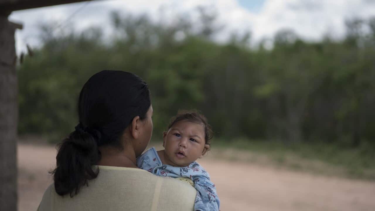 Josiane da Silva holds her son Jose Elton, Brazil