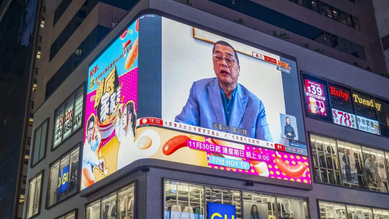 A large neon LED screen showing Hong Kong tycoon Jimmy Lai, who has been found guilty under the national security law, Hong Kong, China.