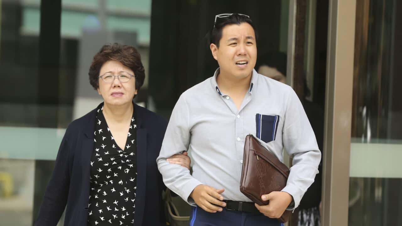 Curtis Cheng's son Alpha Cheng (right), and widow Selina Cheng are seen leaving the Parramatta District Court in Sydney.