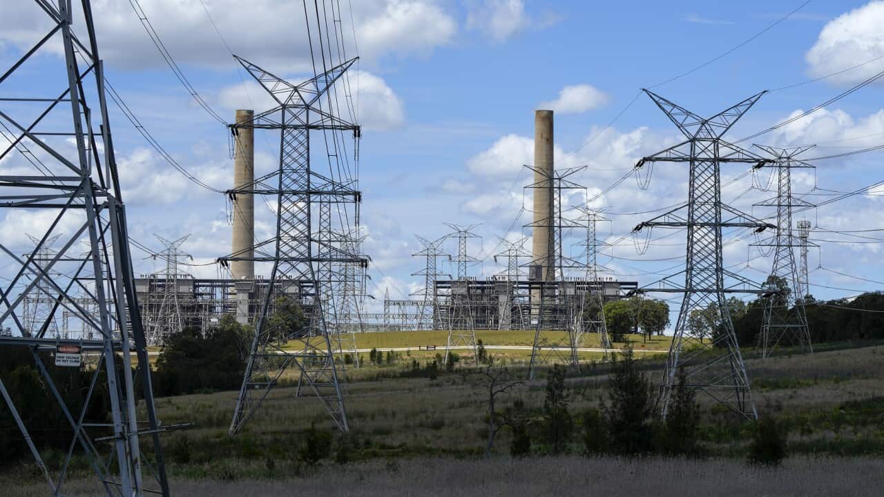 Power lines lead from the Liddell Power Station, a coal-powered thermal power station near Muswellbrook in the Hunter Valley, Australia, Tuesday, Nov. 2, 2021. Efforts to fight climate change are being held back in part because coal, the biggest single so