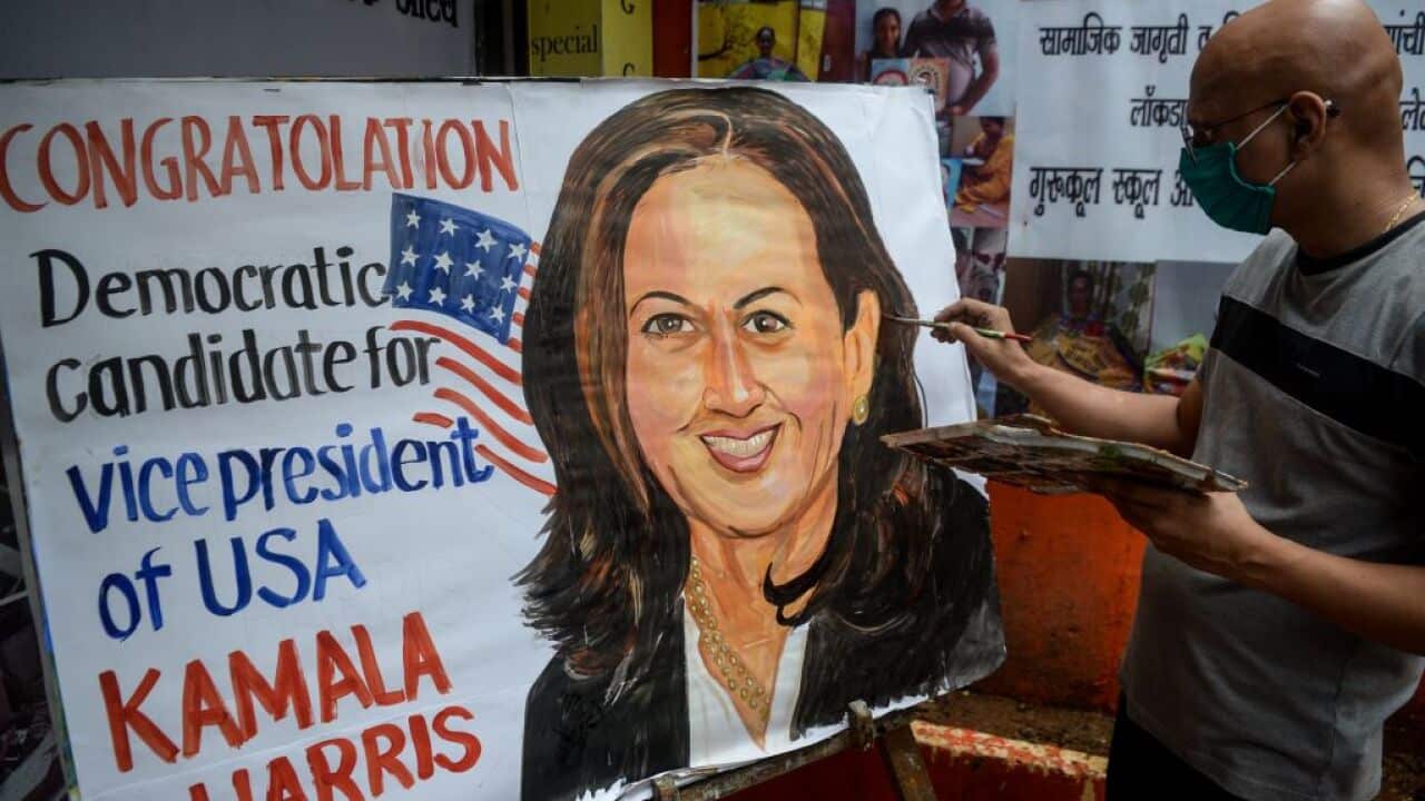 An art enthusiast paints on a canvas the face of presumptive US Democratic Vice President nominee Kamala Harris outside a drawing school in Mumbai on August 13, 2020. (Photo by Indranil MUKHERJEE / AFP) (Photo by INDRANIL MUKHERJEE/AFP via Getty Images)