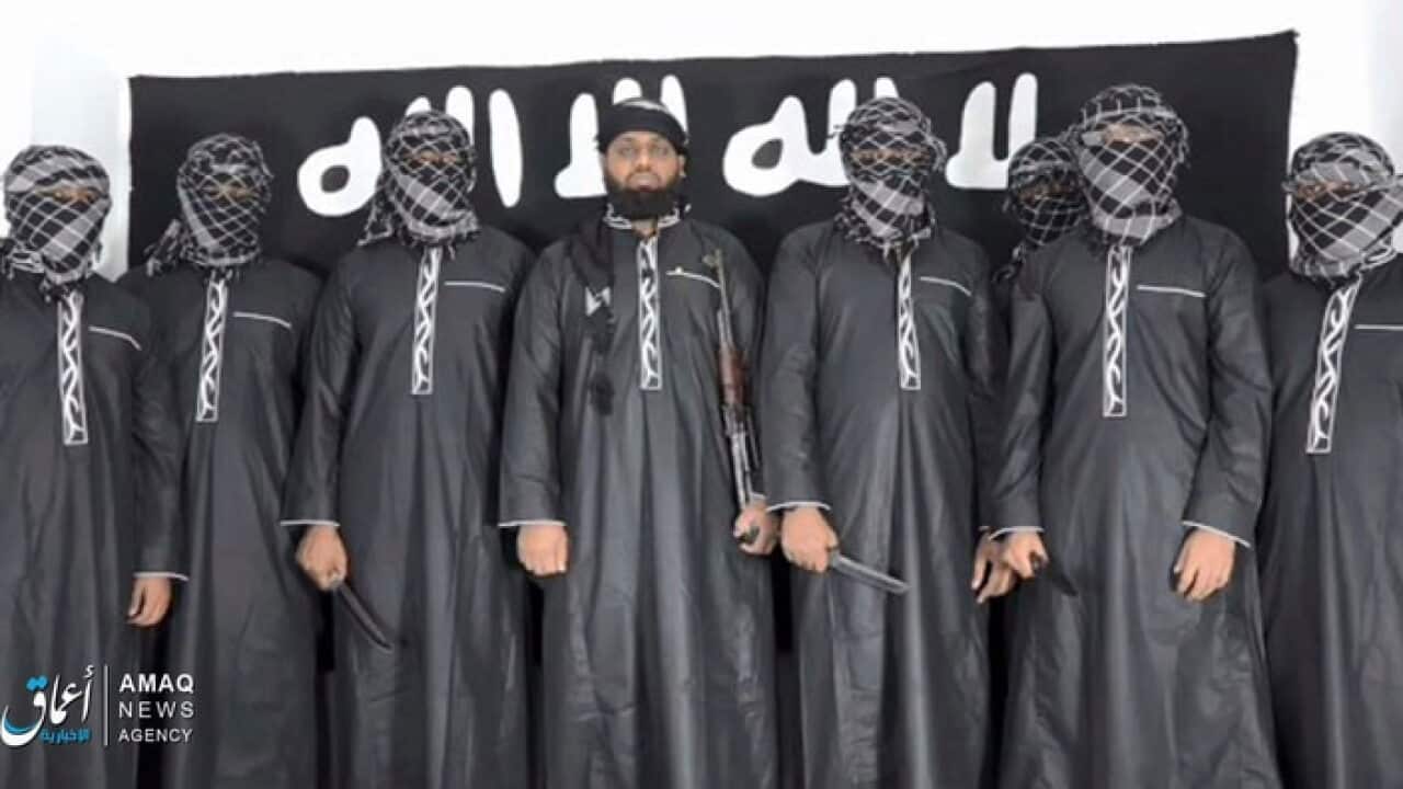 Image posted by the IS Aamaq agency, purporting to show Mohammed Zahran (c) the man Sri Lanka says led the Easter attacks