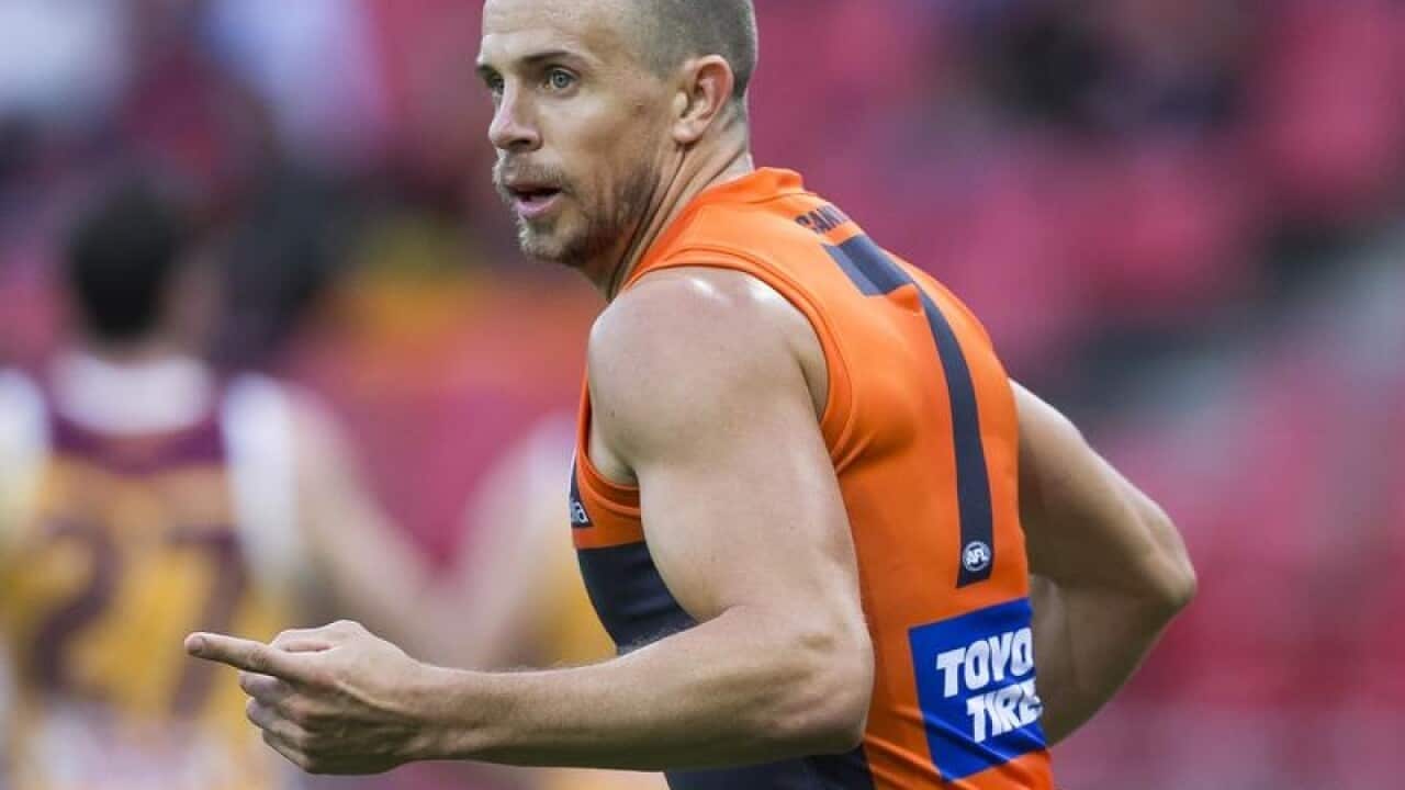 Brett Deledio of the Giants celebrates after kicking a goal