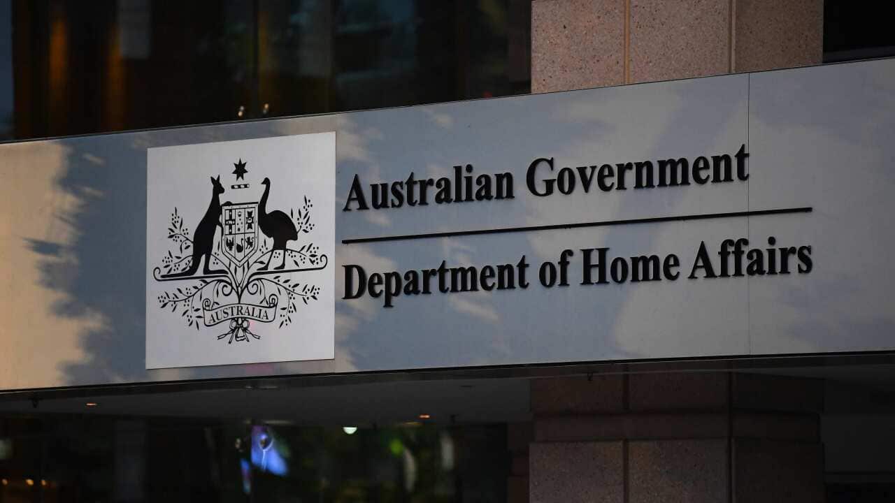 A sign on a building that reads: Australian Government: Department of Home Affairs