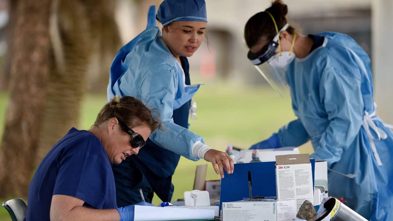 Medical professionals prepare tests at the Bondi Beach drive-through COVID-19 testing centre in Sydney.