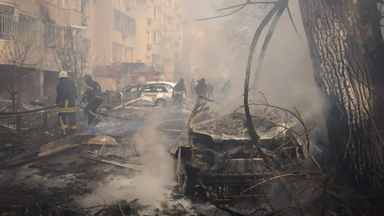 Emergency services personnel work to extinguish a fire following a Russian rocket attack in Odesa, Ukraine, Monday, Nov. 18, 2024