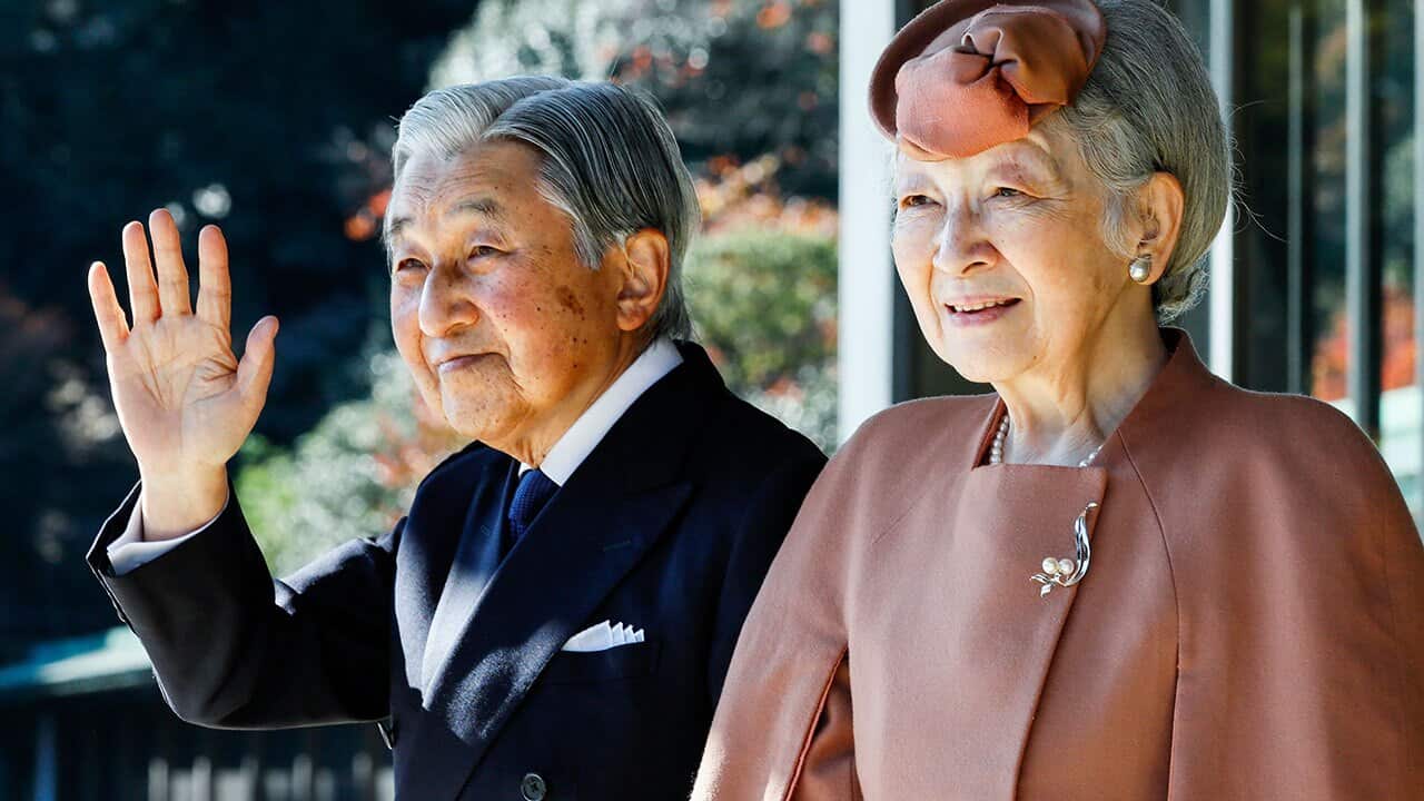 Japan's Emperor Akihito waves with Empress Michiko to Luxembourg's Grand Duke Henri after their meeting at the Imperial Palace in Tokyo  November 27, 2017. 