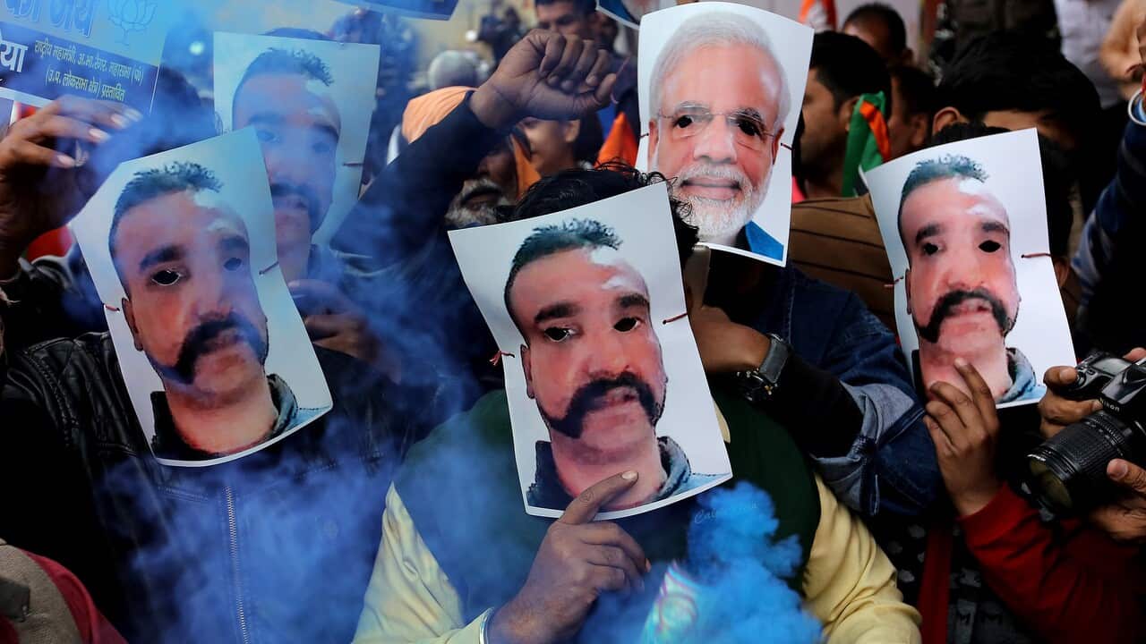 Indian Bhartiya Janata Party (BJP) workers celebrate Varthaman's return, in New Delhi, India.