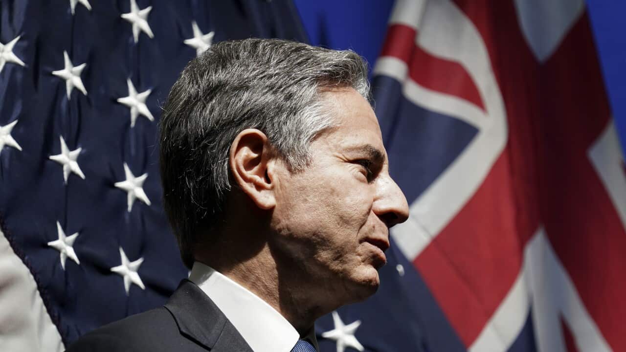 U.S. Secretary of State Antony Blinken listens as he is introduced to speak at a mission Australia meet and greet in Melbourne, Australia, Thursday, Feb. 10, 2022. (Kevin Lamarque/Pool Photo via AP)