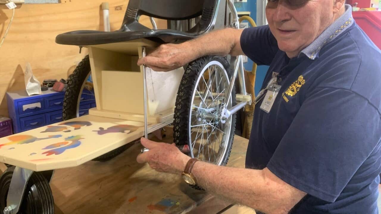 Inventor Des La Rance with a wheelchair made from repurposed bicycles. SBS, Matt Guest .jpg