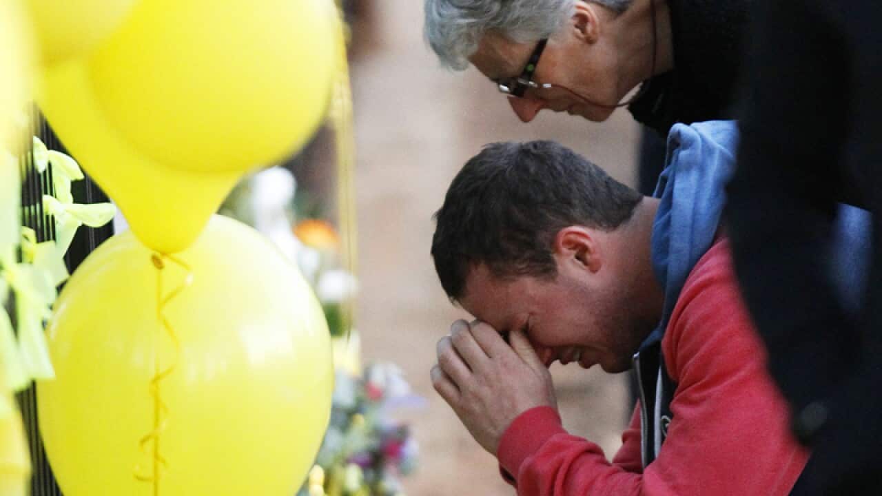 Stephanie Scott's fiance at the scene of a memorial