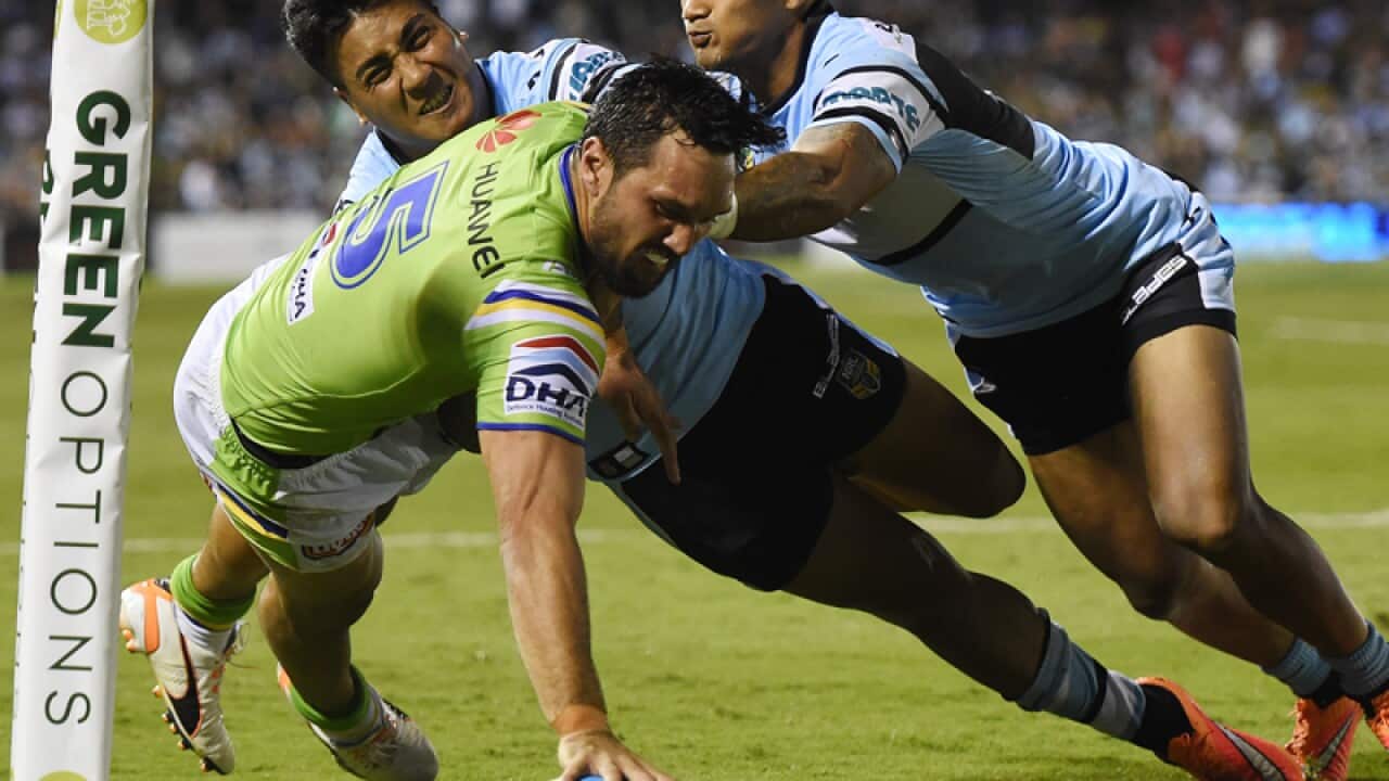 Jordan Rapana of the Raiders scores against the Sharks