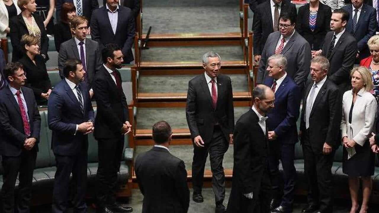 Prime Minister of Singapore Lee Hsien Loong (centre) arrives to address Australian MPs and Senators in the House of Representatives at Parliament House. (AAP)