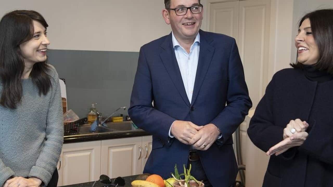 Elizabeth Watt, Daniel Andrews and Marlene Kairouz in a kitchen.