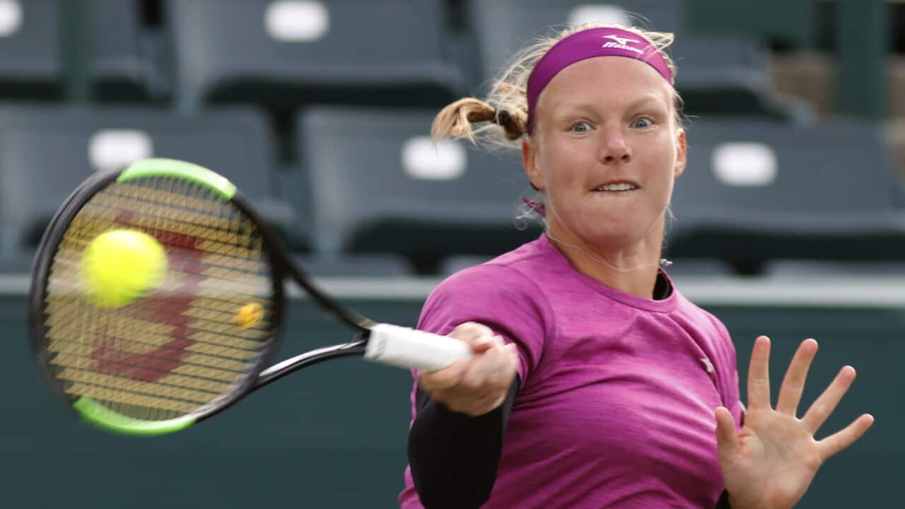 Kiki Bertens returns a shot to Julia Goerges during their championship match at the Volvo Car Open tennis tournament in Charleston (AAP)