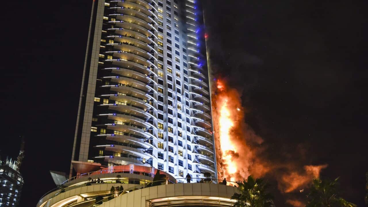 epa05084825 Flames and smoke after a fire broke out at The Address Hotel in Dubai, UAE. 31 December 2015. Media reports state that there is no immediate news of casualties. EPA/STRINGER